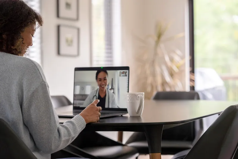 Patient meeting with her clinician remotely via video call